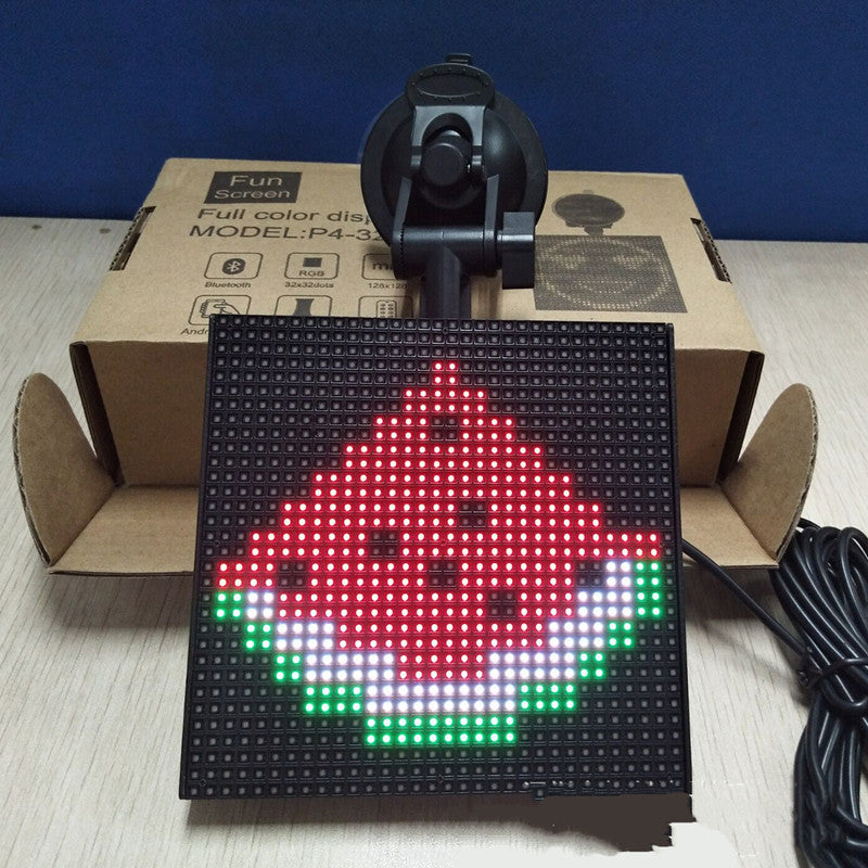 A vibrant square LED car display showcasing colorful emoticons and text, controlled via Bluetooth app.